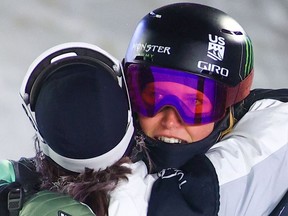 USA's Hanna Faulhaber, right, is embraced by Canada's Rachael Karker following her final run during the women's World Cup freestyle ski halfpipe event in Calgary on Thursday.