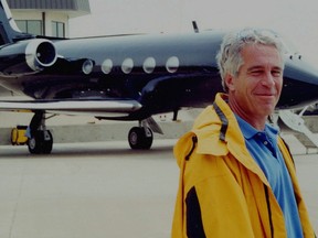 Jeffrey Epstein is pictured in front of a jet in a court exhibit image released by the U.S. Southern District of New York.