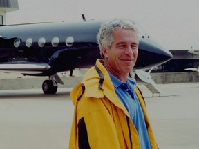 Jeffrey Epstein is pictured in front of a jet in a court exhibit image released by the U.S. Southern District of New York.