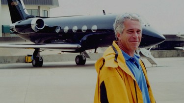 Jeffrey Epstein is pictured in front of a jet in a court exhibit image released by the U.S. Southern District of New York.