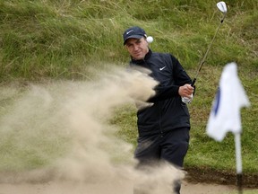 Darren Fichardt of South Africa chips out of a bunker on the 7th during the third practice day at the British Open golf tournament at Royal Birkdale in Southport in north-west England, on July 16, 2008.