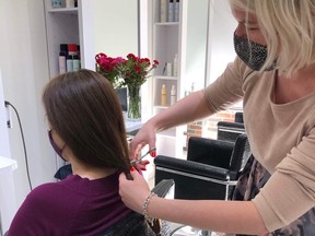 Anastasia Kravtsova with a client at Anastasia Metro Hair Designs in The Beaches neighbourhood.