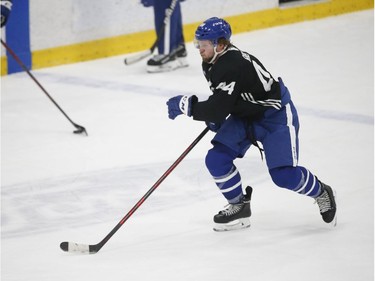 Toronto Maple Leafs Morgan Rielly D (44) gets in some blueline to blueline endurance drills during practice in Toronto on Friday December 31, 2021. Jack Boland/Toronto Sun/Postmedia Network