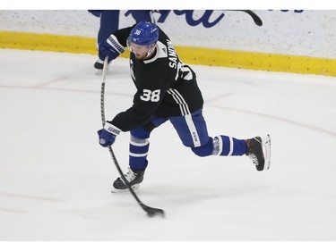 Toronto Maple Leafs Rasmus Sandin D (38) leans into a shot during practice in Toronto on Friday December 31, 2021. Jack Boland/Toronto Sun/Postmedia Network