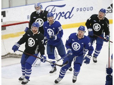 Toronto Maple Leafs Auston Matthews C (34) and teammates wheel around the ice during scrimmage session at practice in Toronto on Friday December 31, 2021. Jack Boland/Toronto Sun/Postmedia Network