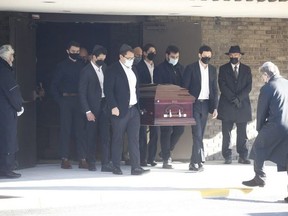 The casket of Mel Lastman is brought out of the Benjamin's Park Memorial Chapel after the former mayor's funeral service on Dec. 13, 2021.