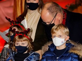 Prince Albert II of Monaco, Prince Jacques and Princess Gabriella inaugurate the Christmas village in Monaco, December 3, 2021.