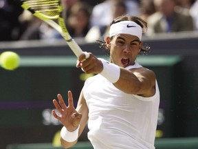 Spain's Rafael Nadal returns the ball during the final tennis match of the 2008 Wimbledon championships against Switzerland's Roger Federer at The All England Tennis Club in southwest London, on July 6, 2008.