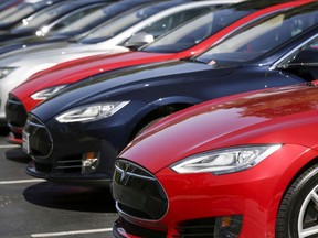 A row of Tesla Model S sedans are seen outside the company's headquarters in Palo Alto, California April 30, 2015.