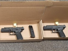 Two of three guns seized by Durham Regional Police at an Oshawa residence on Dec. 25, 2021.