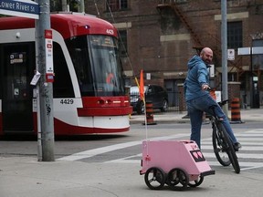 A Tiny Mile robot making a delivery in downtown Toronto