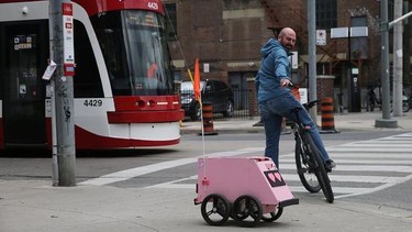 A Tiny Mile robot making a delivery in downtown Toronto