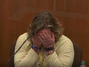 Kimberly Potter, the white former Minnesota police officer who killed Black motorist Daunte Wright in April after claiming she mistook her handgun for her Taser, breaks down in tears as she testifies during her trial in Brooklyn Center, Minnesota, U.S., December 17, 2021 in this image taken from court television footage.
