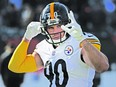 T.J. Watt #90 of the Pittsburgh Steelers waves at fans during pregame warm-ups before the game against the Cincinnati Bengals at Paul Brown Stadium on November 28, 2021 in Cincinnati, Ohio.