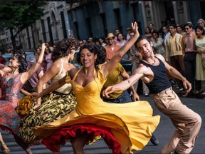 Ariana DeBose as Anita, centre, with David Alvarez as Bernardo, right, in Steven Spielberg's "West Side Story."