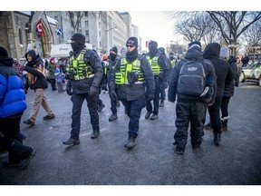 London and Toronto had members of their force join Ottawa police in Ottawa as thousands gathered in the city's downtown core for a protest in connection with the Freedom Convoy, Jan. 29, 2022.