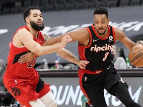 CJ McCollum #3 of the Portland Trail Blazers drives against Fred VanVleet #23 of the Toronto Raptors during the first half of their basketball game at the Scotiabank Arena on January 23.