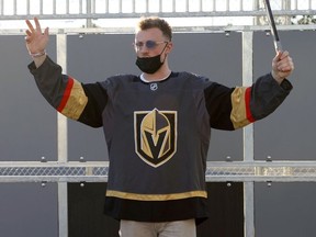 Newly acquired Vegas Golden Knights player Jack Eichel celebrates a kid's goal as he participates in a youth clinic at a ball hockey rink at the Boys & Girls Clubs of Southern Nevada on November 8, 2021 in North Las Vegas, Nevada.