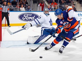 Joseph Woll #60 of the Toronto Maple Leafs blocks the net against Oliver Wahlstrom #26 of the New York Islanders. The two teams meet tonight.