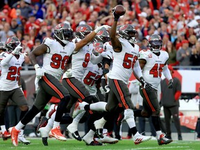 Shaquil Barrett #58 of the Tampa Bay Buccaneers celebrates after intercepting a pass against the Philadelphia Eagles during the third quarter in the NFC wild card game at Raymond James Stadium on January 16, 2022 in Tampa, Florida.