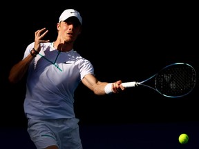 Denis Shapovalov of Canada plays a forehand against Alexander Zverev of Germany during day seven of the 2022 Australian Open at Melbourne Park on January 23, 2022 in Melbourne, Australia.