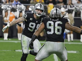 Defensive end Maxx Crosby (left) and defensive tackle Darius Philon of the Las Vegas Raiders.