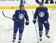 Toronto Maple Leafs' Josh Ho-Sang (left) skates during training camp.