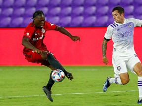 Toronto FC forward Ayo Akinola (20) controls the ball against Orlando City in the second half at Orlando City Stadium last June.