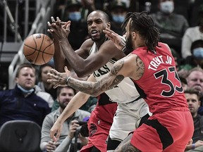 Raptors guard Gary Trent Jr. (33) tries to steal the ball from Bucks forward Khris Middleton. Trent Jr.’s defence has been a pleasant surprise this season.