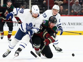 Toronto Maple Leafs' William Nylander (88) and Arizona Coyotes left wing Lawson Crouse (67) battle for the puck during the second period at Gila River Arena on Wednesday night.