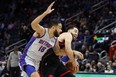 Toronto Raptors guard Fred VanVleet (23) is fouled by Detroit Pistons guard Cory Joseph (18) in the first half at Little Caesars Arena.
