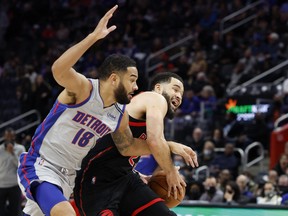 Toronto Raptors guard Fred VanVleet (23) is felled by Detroit Pistons guard Cory Joseph (18) in the first half at Little Caesars Arena.