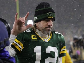 Green Bay Packers quarterback Aaron Rodgers (12) reacts while leaving the field after the NFC divisional playoff round game against the San Francisco 49ers on Saturday.