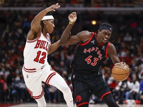 Raptors forward Pascal Siakam (43) is defended by Chicago Bulls guard Ayo Dosunmu  on Wednesday night.