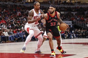 Toronto Raptors guard Gary Trent Jr. (33) drives to the basket against Chicago Bulls forward DeMar DeRozan (11) during the second half at United Center.