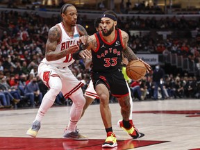 Toronto Raptors guard Gary Trent Jr. (33) drives to the basket against Chicago Bulls forward DeMar DeRozan (11) during the second half at United Center.