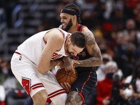 Bulls centre Nikola Vucevic (9) battles for the ball with guard Gary Trent Jr. (33) during the second half at United Center.