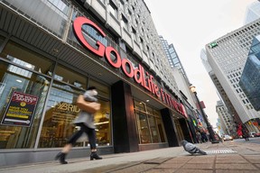 A woman walks by a closed GoodLife Fitness centre in Toronto on January 5, 2022.