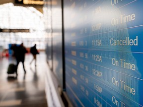 "Cancelled" is displayed on a flight schedule board at Ronald Reagan Washington National Airport (DCA) in Arlington, Virginia, on Jan. 15, 2022.
