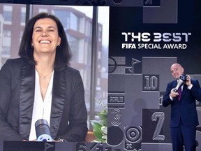 FIFA President Gianni Infantino (R) presents the FIFA Special Best Women's award to Canada's Christine Sinclair during the Best FIFA Football Awards 2021 on January 17, 2022 in Zurich, Switzerland.