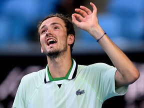 Russia's Daniil Medvedev reacts after a point against Maxime Cressy of the U.S. during their men's singles match on day eight of the Australian Open tennis tournament in Melbourne on January 24, 2022.