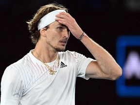 Germany's Alexander Zverev celebrates after winning his second-round match against Australia's John Millman January 19, 2022, at Melbourne Park.