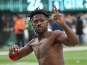 Buccaneers wide receiver Antonio Brown gestures to the crowd as he leaves the field while his team’s offence was on the field against th Jets during the third quarter of an NFL game Sunday, Jan. 2, 2022, in East Rutherford, N.J.