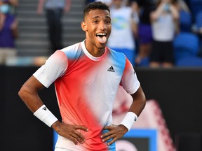 Felix Auger-Aliassime celebrates after beating Alejandro Davidovich Fokina in their men's singles match at the Australian Open in Melbourne on January 20, 2022.