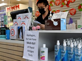 A pharmacy displays a sign to inform customers that rapid antigen test kits are sold out in wake of COVID-19 in Sydney, Jan. 5, 2021.