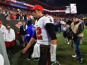 Tom Brady of the Tampa Bay Buccaneers reacts after being defeated by the Los Angeles Rams 30-27 in the NFC Divisional Playoff game at Raymond James Stadium on January 23, 2022 in Tampa, Florida.
