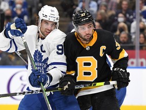 Maple Leafs captain John Tavares (left) battles for position with Boston Bruins counterpart Patrice Bergeron earlier this season. The Bruins are on a five-game winning streak and closing fast on the third-place Toronto in the Atlantic Division.