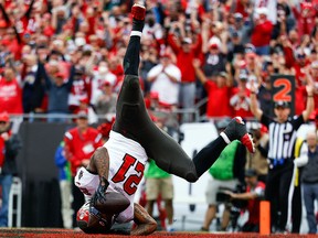 Tampa Bay Buccaneers running back Ke'Shawn Vaughn (21) scores a touchdown against the Philadelphia Eaglesin a NFC Wild Card playoff football game at Raymond James Stadium.