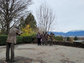 Anyone travelling to the sculpture known as "The Photo Session" by J. Seward Johnson Jr. at the top of Queen Elizabeth Park in Vancouver, B.C., will also get a wonderful view of the city.
