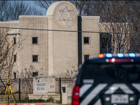 A law enforcement vehicle sits in front of the Congregation Beth Israel synagogue on Jan. 16, 2022 in Colleyville, Texas.